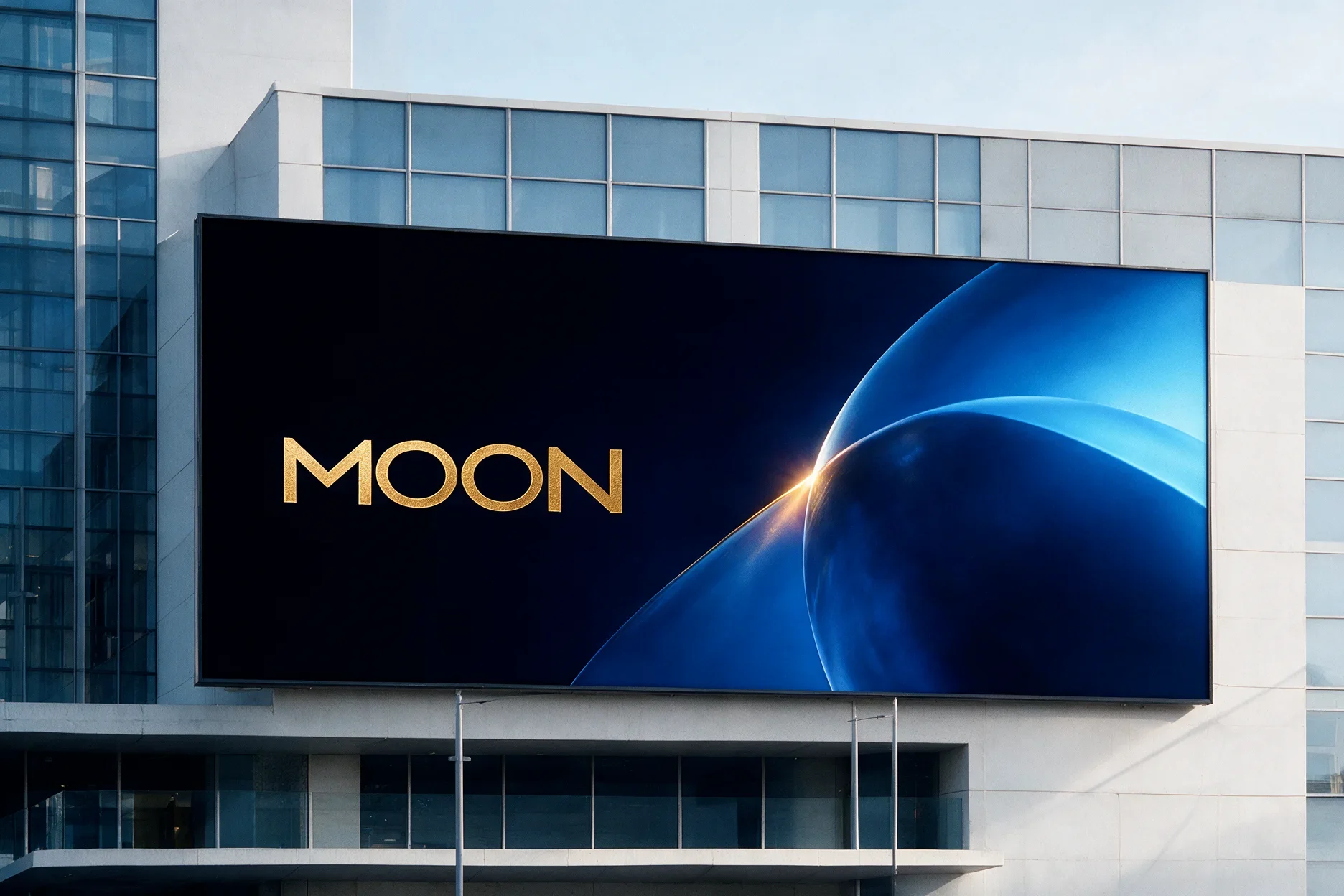 Moon gold wordmark and blue abstract imagery on an outdoor billboard mockup